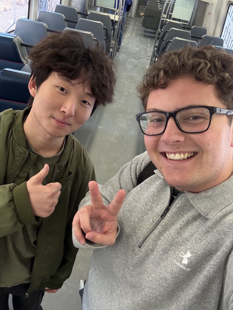 two people on a train